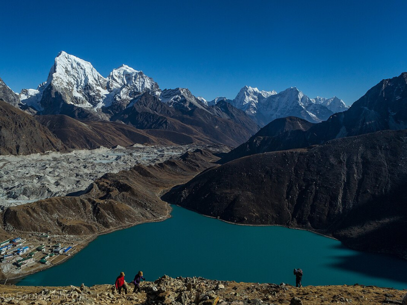 Clear Gokyo Lake with mountain reflections.